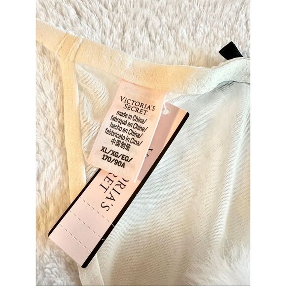 White sheer Victoria’s Secret thong new with tags with black bow detail and pom- - Picture 3 of 6